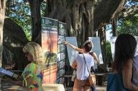 People viewing large posterboards with BLM and Jupiter Inlet Lighthouse Outstanding Natural Area info during an open house at the ONA