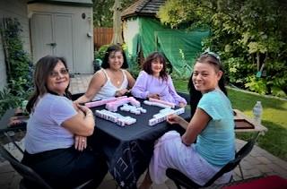 Jennifer Pable's mom plays mahjong with friends at a celebration.  Photo courtesy of Jennifer Pable.
