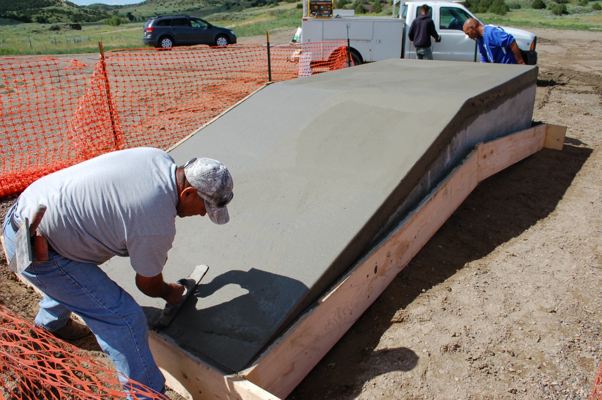 Volunteers help install loading ramps