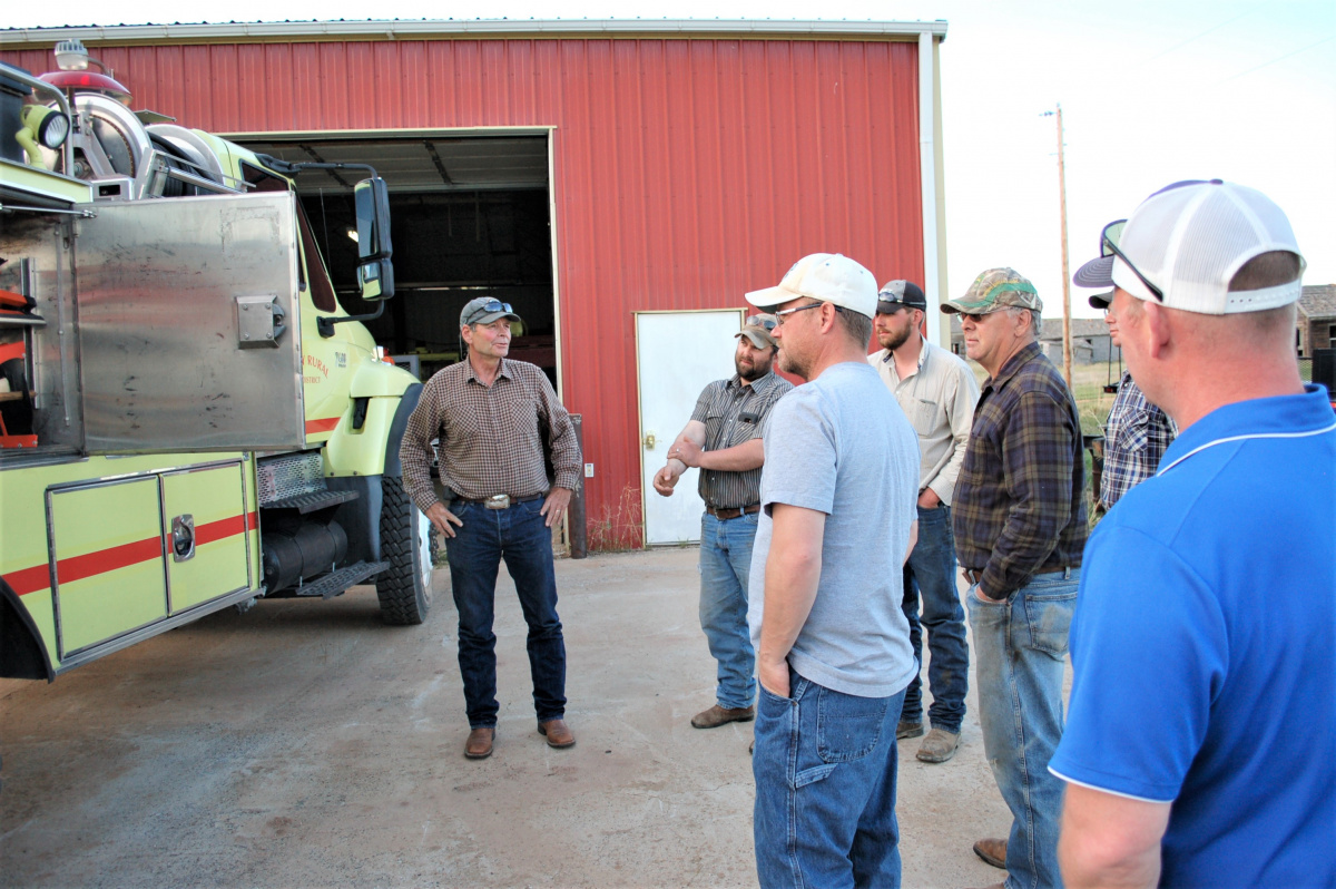 Members of the Miles City Field Office explain the fire truck to the Ismay Fire Department