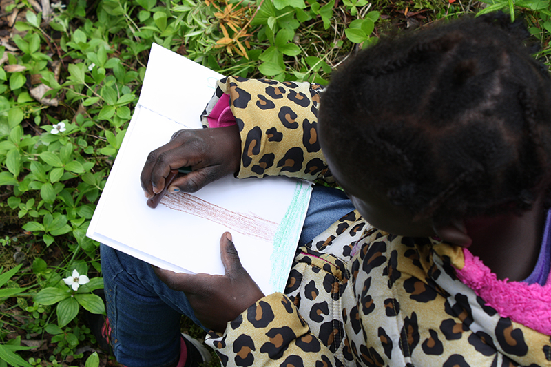 girl drawing a tree