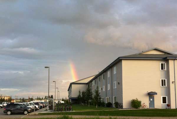 Barracks with rainbow in the sky