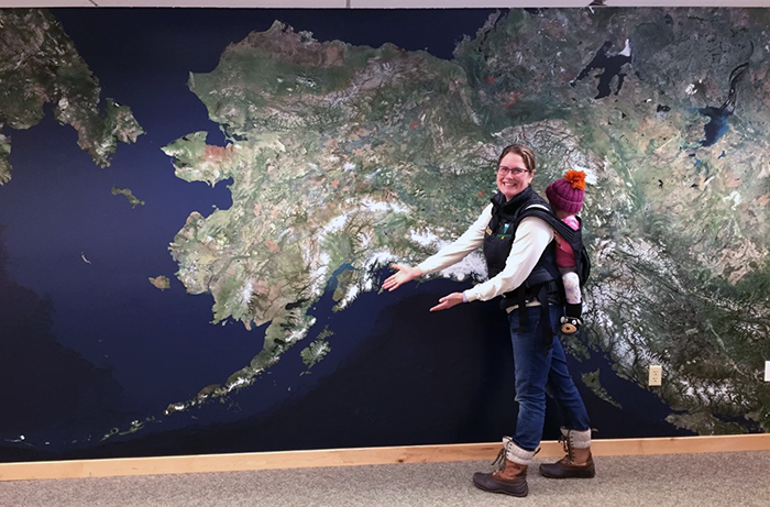 Mom and child standing in front of Alaska Wall Map exhibit at the Campbell Creek Science Center