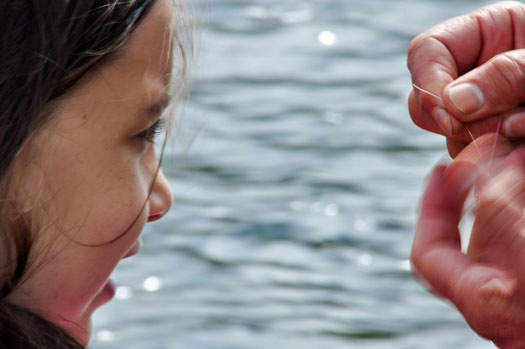 Young girls learns to fish on public lands. BLM photo