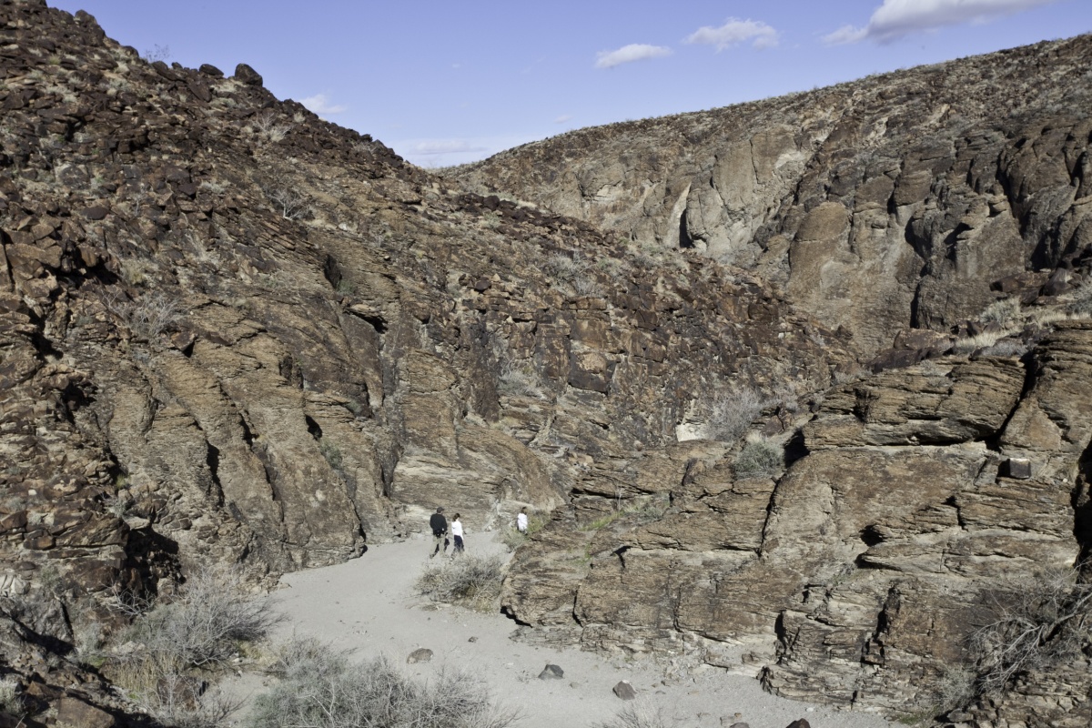 View of hikers on winding trail at Sloan Canyon