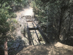 Pictured is a trail bridge that burned during the River Fire. Photo by Molly Nilsson, BLM