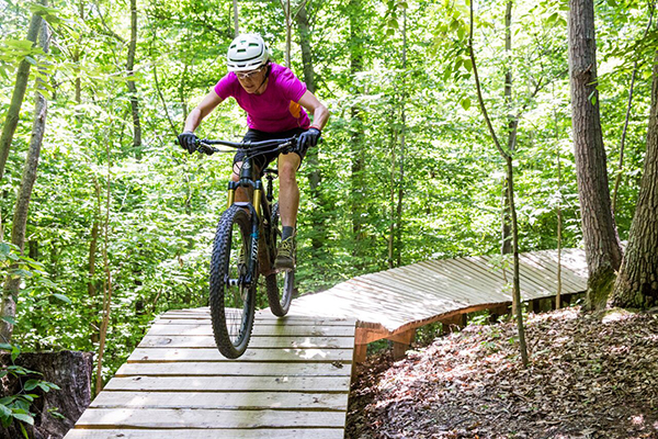 an experienced rider on a trail built in partnership with the Mid-Atlantic Off-Road Enthusiasts (MORE). 