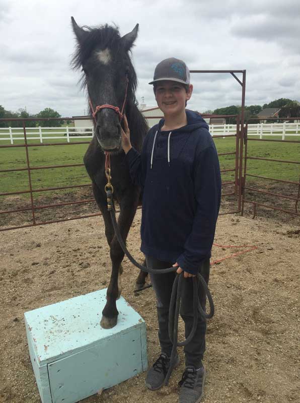 Tucker Worley of Fort Worth, Texas with Birdie, a yearling filly from the Fish Creek Herd Management Area in Nevada. 