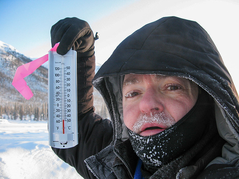 A man holding a thermometer