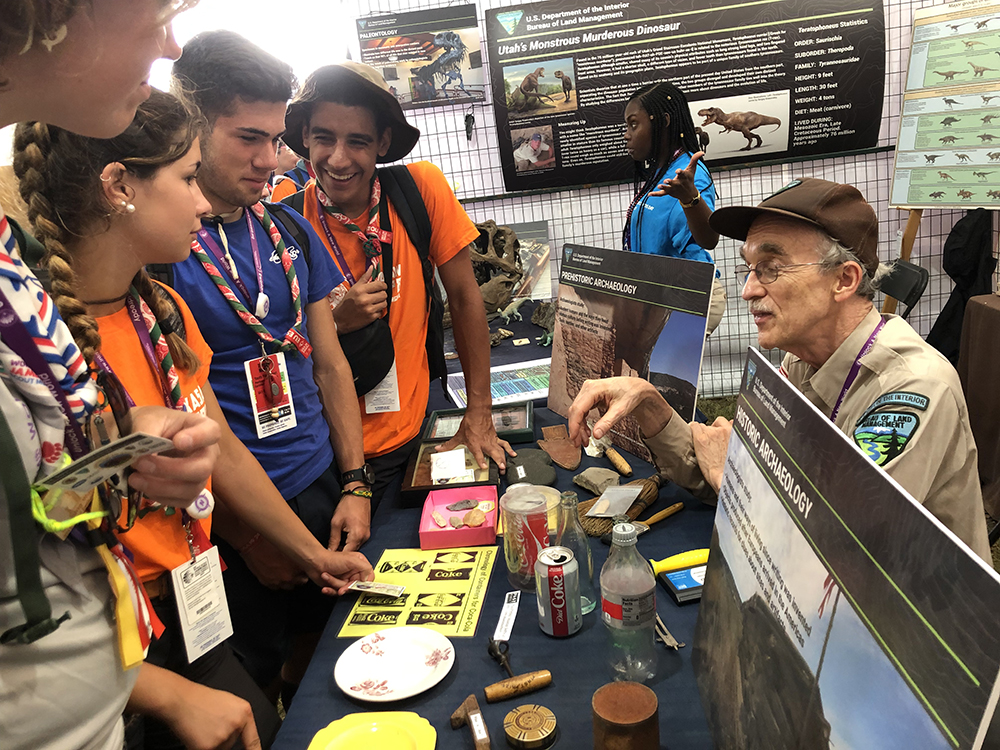 Bob king talking to scouts at BLM booth in the DOI Tent