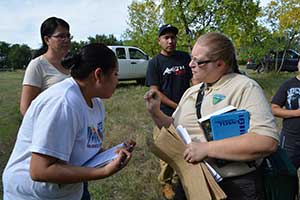 BLM botanist Wendy Velman shows students