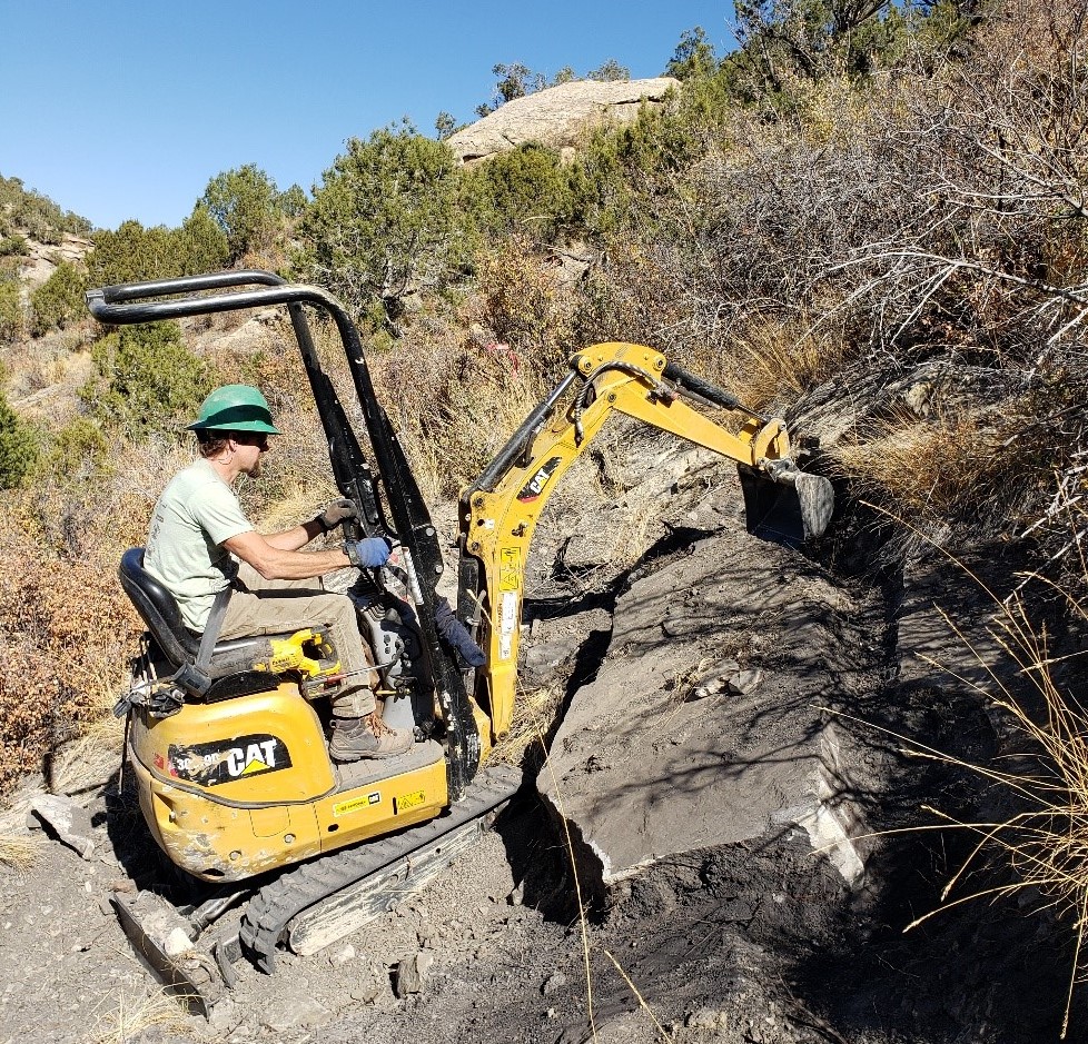 Shawn Gregory uses a mini-excavator 