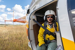 firefighter standing in burning landscape