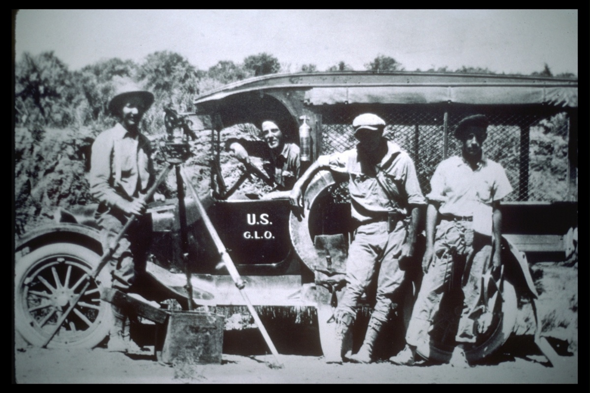A black and white historic photo of a group of land surveyors. BLM photo.