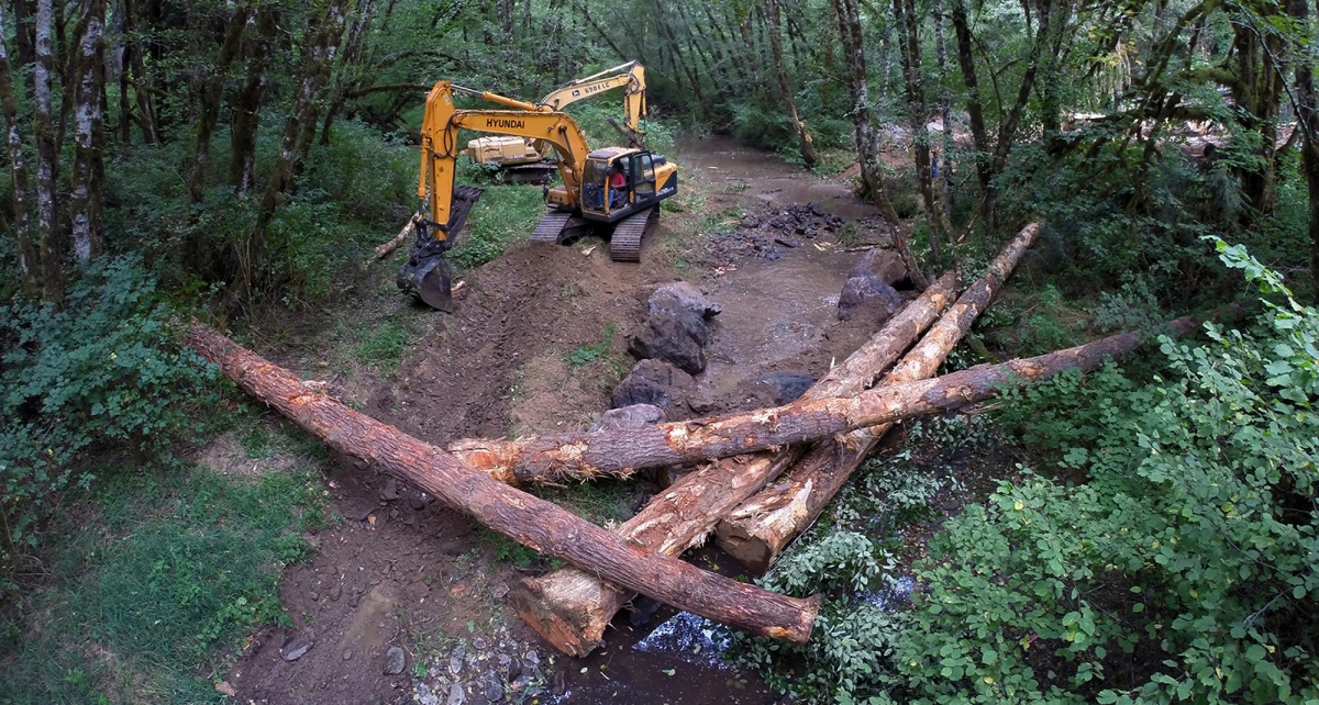 A large machine clears a stream area in Oregon. BLM photo.
