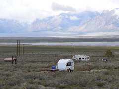 Trailers at campsite with mountains in the distance. Photo by Steve Nelson, BLM. 