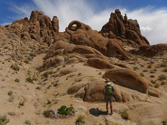 Rocky boulders in the foreground with snow capped mountains in the background.  (Dave Kirk/BLM)