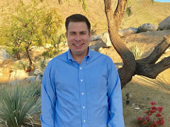 A man stands in a desert landscape. (BLM Photo)