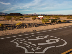 The Route 66 Highway runs past Amboy Crater, photo by Bob Wick/BLM