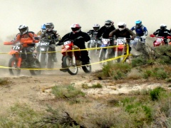 Motorcycles race on a marked course on public lands. (Jeff Fontana/BLM)