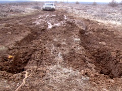 A car is stuck in the mud.