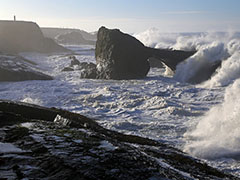 Waves crash on rocks off the California coast.  Photo by David Legid, BLM.