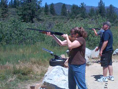 A group of people target shoot in a mountain area (Eric Coulter/BLM)