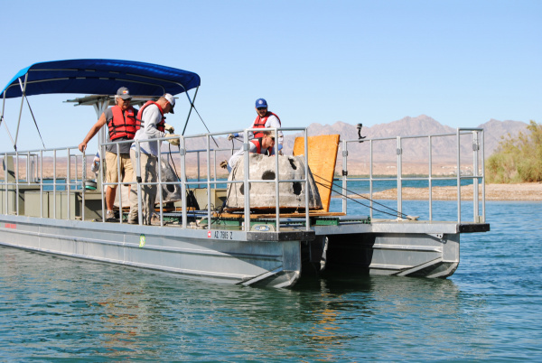 honeycomb-shaped concrete structures sit on a boat