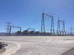 Several grey capacitors at a power sub station.