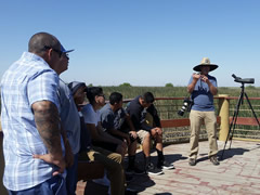 A group of people gathered on a wooden platform overlooking a wetland area.  Photo courtesy of Francisco Escamilla, Atwell Island Project-Work Based Learning Program.