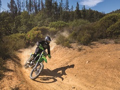 Dirtbike speeds around a turn at South Cow Mountain OHV Recreation Area. Photo by Thomas Delgado, BLM Volunteer.