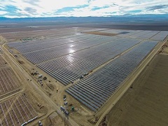 A solar array reflects sunlight. Photo courtesy of Recurrent Energy.