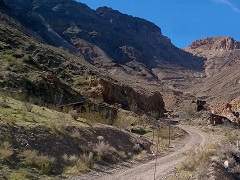 Photo of dirt road along a cliff face.