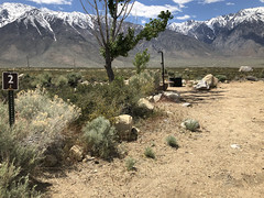 A basic campground at the base of snow capped mountains. Photo by Serena Baker/BLM.