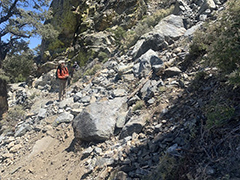 Hike on a trail next to a rock slide. (BLM Photo)