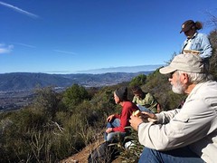 Volunteers take in the view of green, dry rolling mountains at South Cow Mountain. Photo by Ron McDonell, BLM volunteer.  