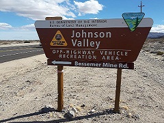 Image of a brown sign for Johnson Valley OHV Recreation Area. Photo by BLM). 