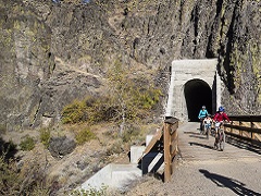 Family emerges from old rail tunnel on the Bizz Johnson Trail. Photo by Bob Wick/BLM.