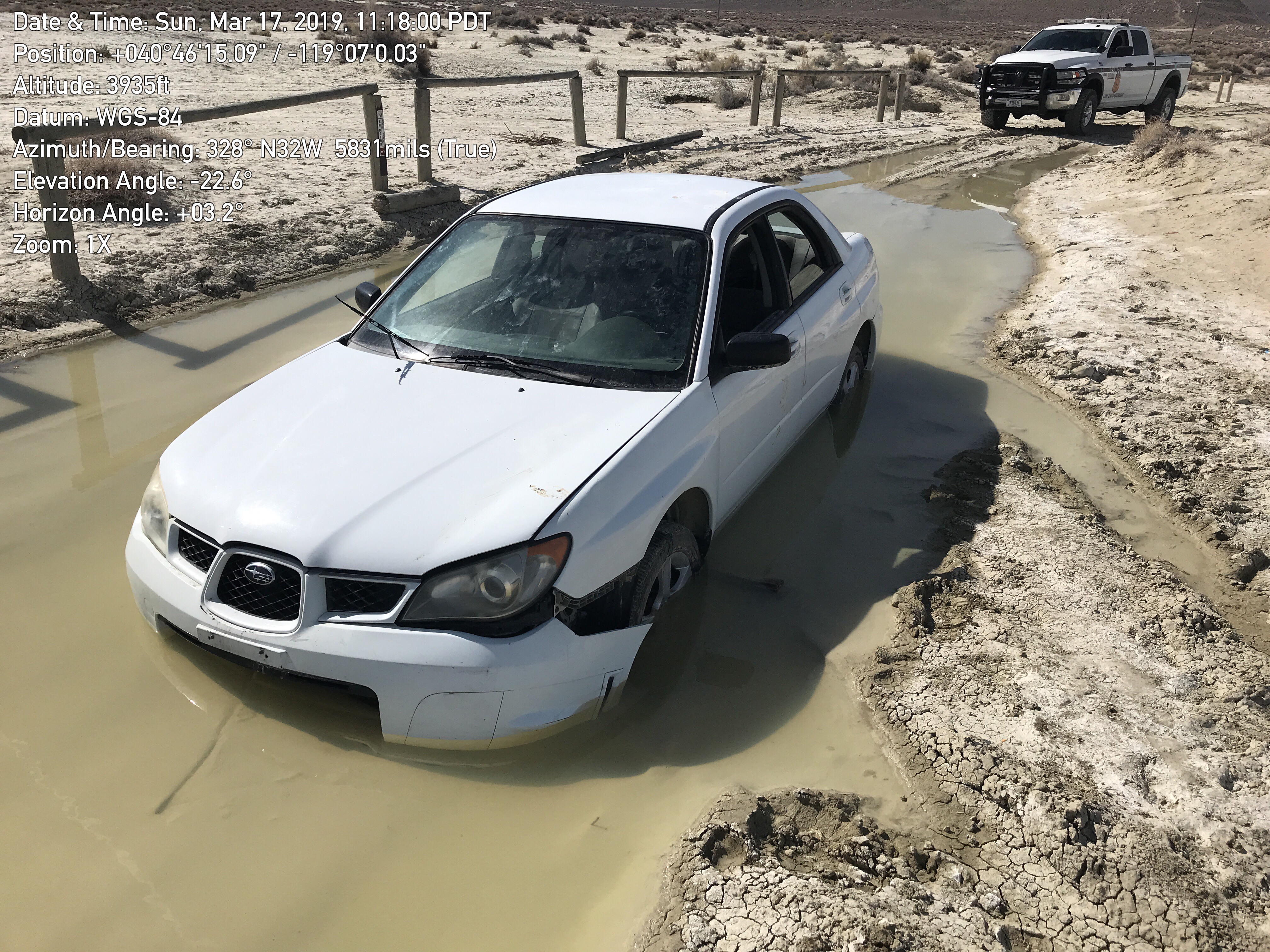 A vehicle is stuck in the mud on the way to Trego Hot Springs.
