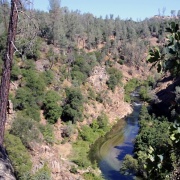 photo of creek flowing through a canyon