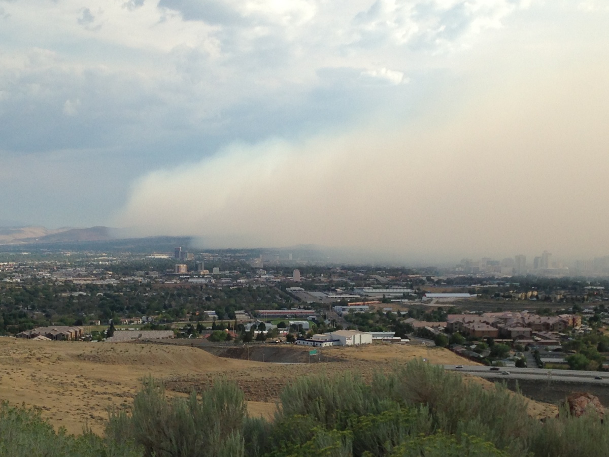 A wall of smoke invaded the Reno-Carson City area late Sunday afternoon as winds accompanying an outflow boundary spread eastward from showers and thunderstorms west of Reno and Carson City.