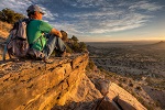A man sits on an overlook at Cabezon Peak Wilderness in New Mexico. Photo by Bob Wick, BLM.