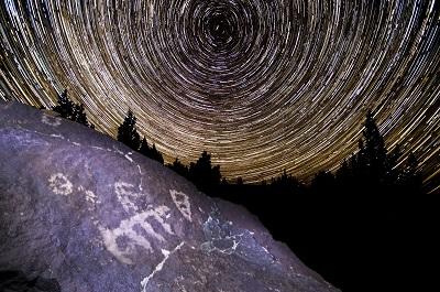 Star swirl over petroglyphs