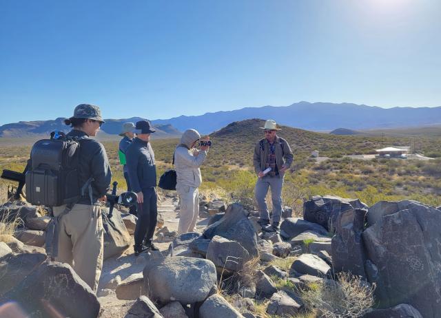 Las Cruces District archaeologist Cody Dalpra leading an interpretive hike at the Three Rivers Petroglyph Site.