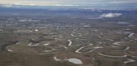 Aerial photo of the tundra and rivers of the Northeast National Petroleum Reserve in Alaska.