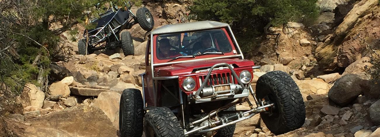 Two rock crawlers navigate over the rocks in Coyote Canyon, Moab.