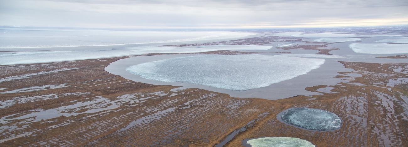 Several partially frozen lakes in late fall in the National Petroleum Reserve in Alaska.