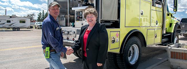 Former BLM-WY State Director Mary Jo Rugwell presents type 4 engine to Chugwater FD
