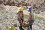 Members of the Conservation Corps New Mexico youth corps carrying rock to build the trails.