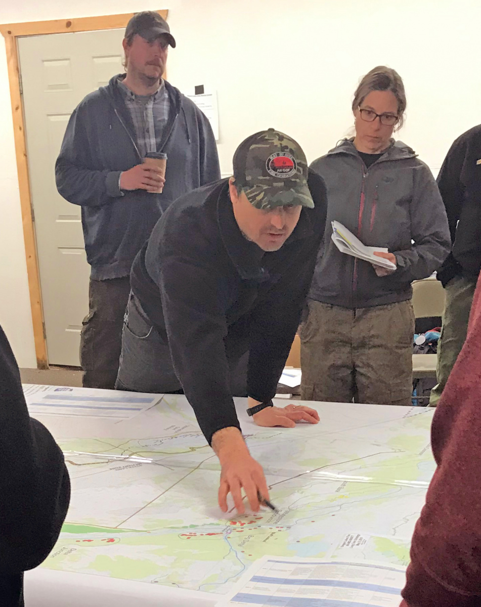 Fire Management Officers discussing prescribed burns